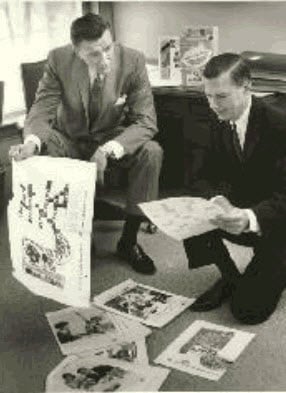 Fred Smart and F. Kent Mitchell, Post Products Division-General Foods, with 1961 Post cereal boxes in the background.