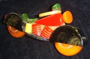 Brightly colored Catalin toy motorcycle