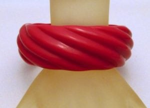 Vintage lucite could be colored and molded into many shapes and designs.  This is a vintage bracelet.