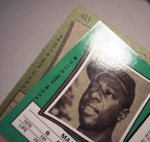 The reprint 1971 Hank Aaron has an different gloss (shiney) and coloring than the original card.