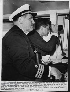 John F. Kennedy and Commander Harold Lang aboard an aircraft carrier in 1962